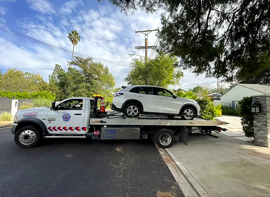 Flatbed delivery: SUV loaded and secured in the Valley